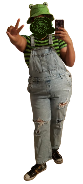 overalls with a striped green and black shirt and a froggy hat