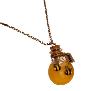 a neckclase with a pot of honey