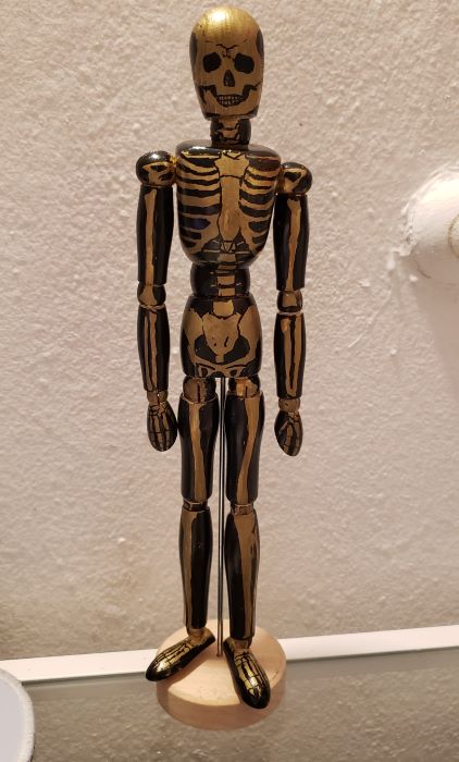 skeleton trophy from costume party