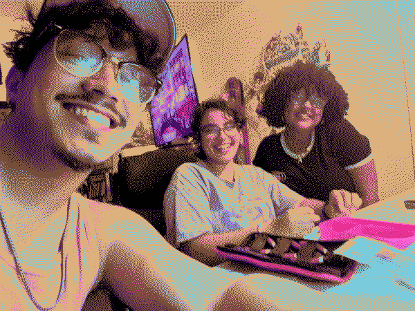 selfie taken with three people