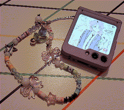 a closed samsung galazy z flip 5 with a long and colorful wrist charm
