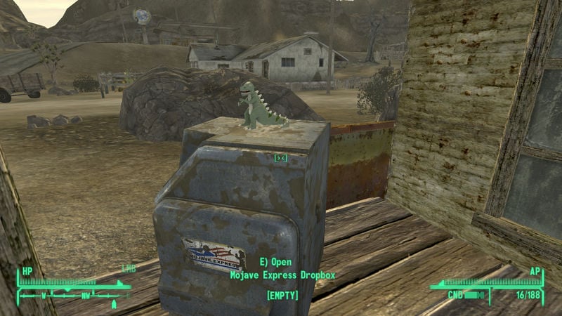 screenshot of new vegas. there's a mojave express dropbox shown with a dinosaur toy on top of it as decoration.